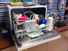 A portable dishwasher with dishes